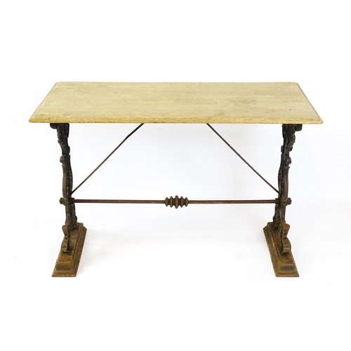 820 - Garden / Architectural: A late 19thC / early 20thC table with a cast iron base. 44