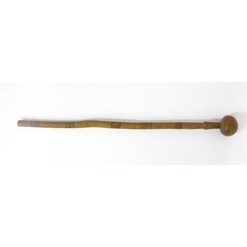 1110 - Ethnographic / Native / Tribal : An African knobkerrie with carved decoration. Together with a Austr... 