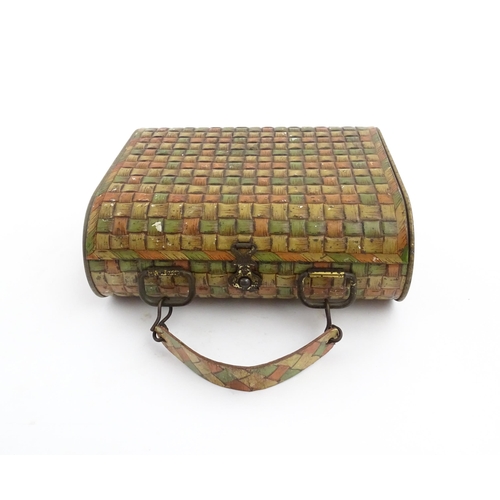 1121 - A Huntley & Palmer novelty biscuit tin formed as a woven picnic basket. Approx. 7