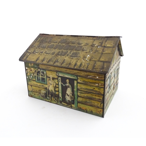 1122 - A novelty S. Henderson & Sons Ltd. biscuit tin formed as a log cabin, with figures, a dog and a hors... 