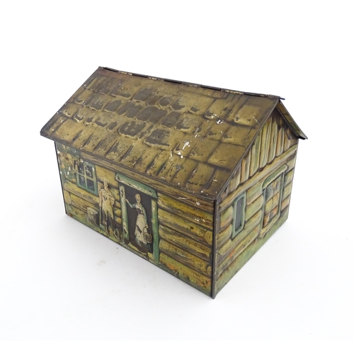 1122 - A novelty S. Henderson & Sons Ltd. biscuit tin formed as a log cabin, with figures, a dog and a hors... 