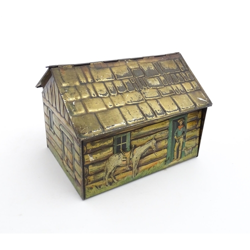 1122 - A novelty S. Henderson & Sons Ltd. biscuit tin formed as a log cabin, with figures, a dog and a hors... 