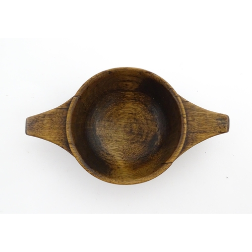 1128 - Treen : A 19thC Scottish turned wooden quaich. Approx. 4 3/4