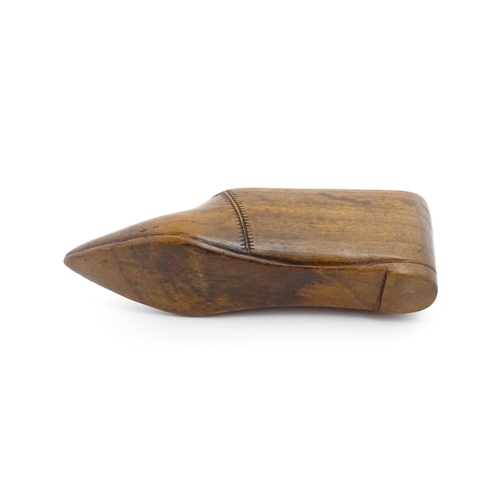 1185 - Treen : A 19thC Continental shoe table snuff box with chip carved decoration to the sliding top. App... 