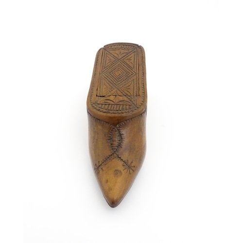 1185 - Treen : A 19thC Continental shoe table snuff box with chip carved decoration to the sliding top. App... 