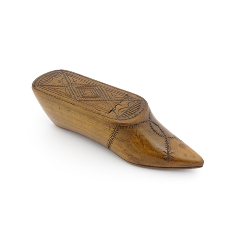 1185 - Treen : A 19thC Continental shoe table snuff box with chip carved decoration to the sliding top. App... 