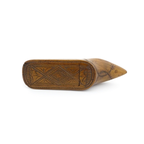 1185 - Treen : A 19thC Continental shoe table snuff box with chip carved decoration to the sliding top. App... 