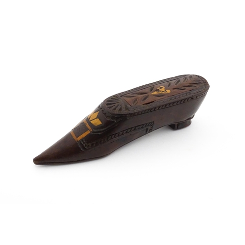 1187 - Treen : A 19thC Continental shoe snuff box with sliding top, decorated with carved and inlaid decora... 