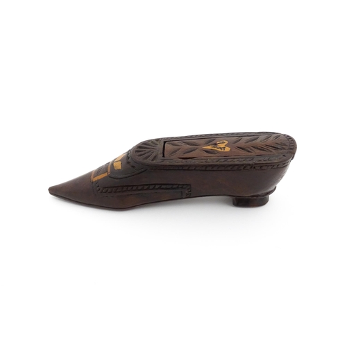 1187 - Treen : A 19thC Continental shoe snuff box with sliding top, decorated with carved and inlaid decora... 