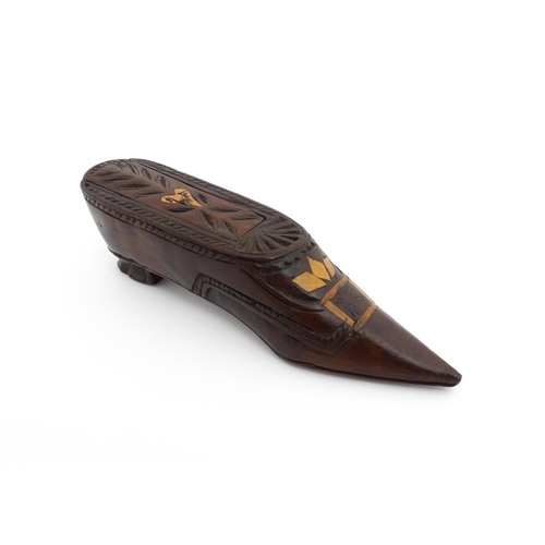 1187 - Treen : A 19thC Continental shoe snuff box with sliding top, decorated with carved and inlaid decora... 