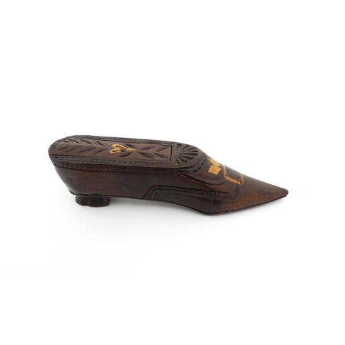 1187 - Treen : A 19thC Continental shoe snuff box with sliding top, decorated with carved and inlaid decora... 