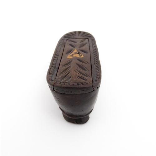 1187 - Treen : A 19thC Continental shoe snuff box with sliding top, decorated with carved and inlaid decora... 