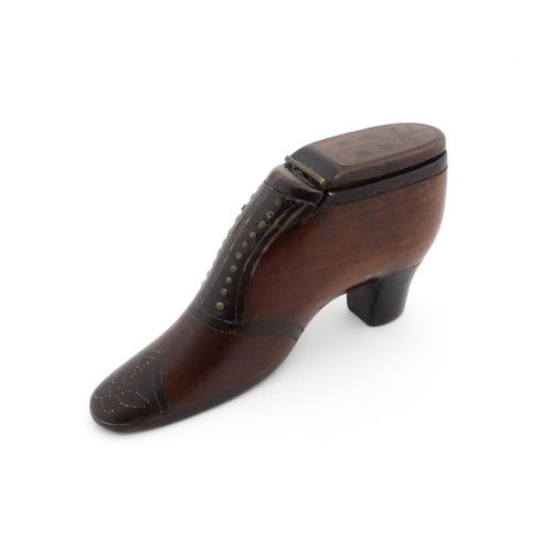 1188 - Treen : A 19thC shoe snuff box of heeled boot form, the hinged lid with bird, flower and folate deta... 