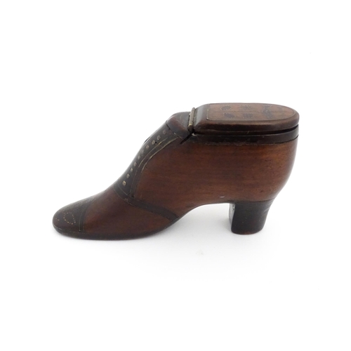 1188 - Treen : A 19thC shoe snuff box of heeled boot form, the hinged lid with bird, flower and folate deta... 