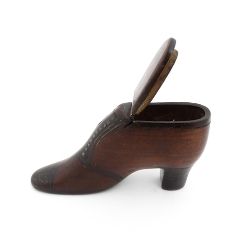 1188 - Treen : A 19thC shoe snuff box of heeled boot form, the hinged lid with bird, flower and folate deta... 