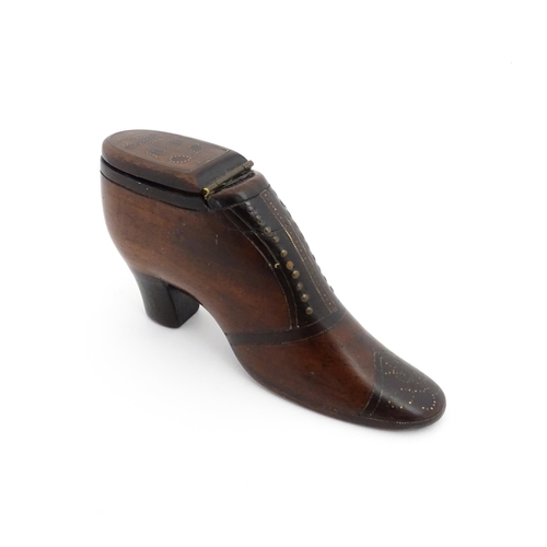 1188 - Treen : A 19thC shoe snuff box of heeled boot form, the hinged lid with bird, flower and folate deta... 