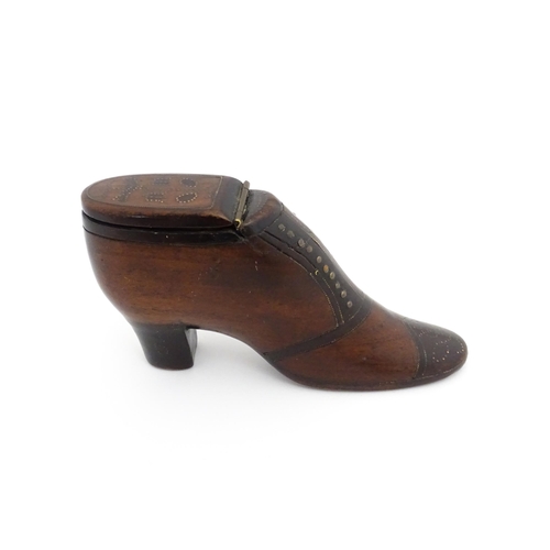 1188 - Treen : A 19thC shoe snuff box of heeled boot form, the hinged lid with bird, flower and folate deta... 