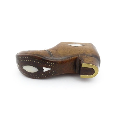 1189 - Treen : A 19thC Continental shoe table snuff box with sliding lid and upturned toe decorated with br... 