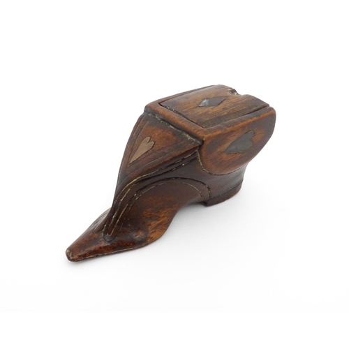 1191 - Treen : A 19thC shoe snuff box of unusual form with sliding lid and inlaid heart decoration. Approx.... 