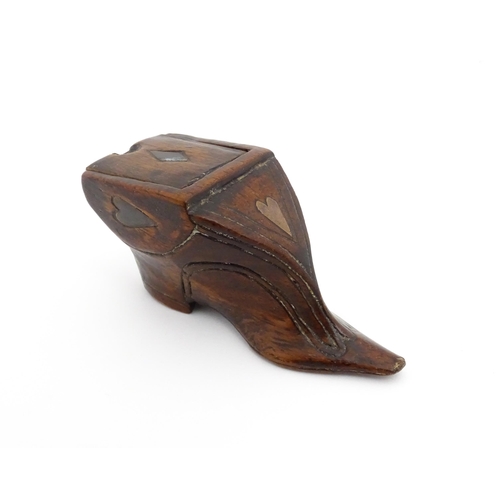 1191 - Treen : A 19thC shoe snuff box of unusual form with sliding lid and inlaid heart decoration. Approx.... 