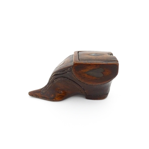 1191 - Treen : A 19thC shoe snuff box of unusual form with sliding lid and inlaid heart decoration. Approx.... 