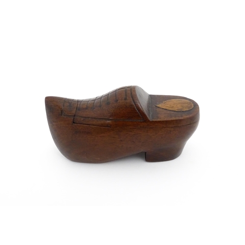 1192 - Treen : A 19thC Continental shoe snuff box the swivel top with carved and inlaid decoration. Approx.... 