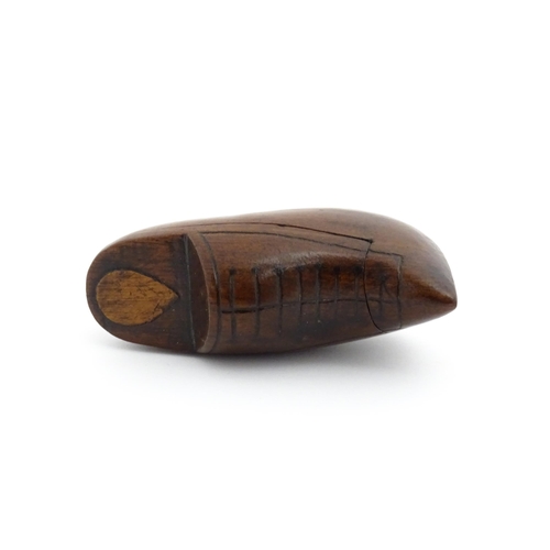 1192 - Treen : A 19thC Continental shoe snuff box the swivel top with carved and inlaid decoration. Approx.... 