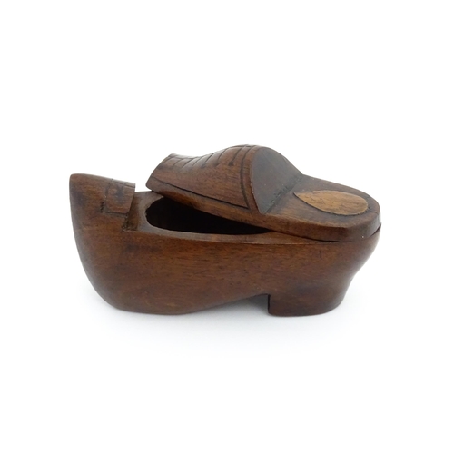 1192 - Treen : A 19thC Continental shoe snuff box the swivel top with carved and inlaid decoration. Approx.... 