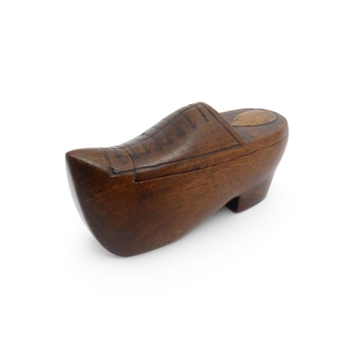 1192 - Treen : A 19thC Continental shoe snuff box the swivel top with carved and inlaid decoration. Approx.... 