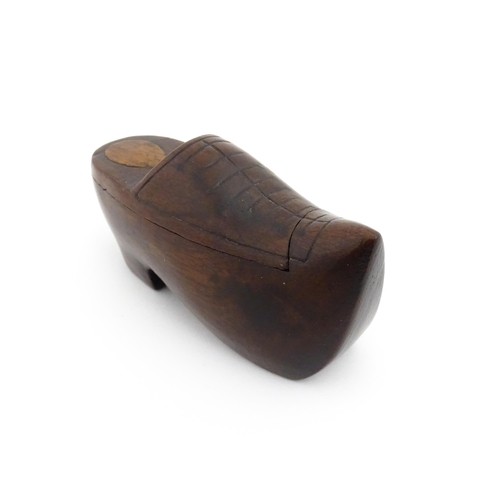 1192 - Treen : A 19thC Continental shoe snuff box the swivel top with carved and inlaid decoration. Approx.... 