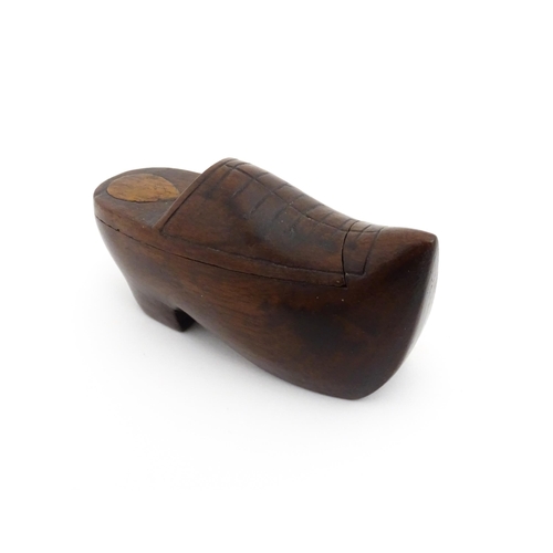 1192 - Treen : A 19thC Continental shoe snuff box the swivel top with carved and inlaid decoration. Approx.... 