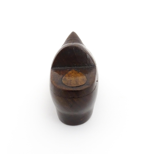 1192 - Treen : A 19thC Continental shoe snuff box the swivel top with carved and inlaid decoration. Approx.... 