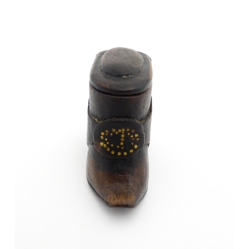 1197 - Treen : A 19thC Continental shoe snuff box of boot form with sliding lid and brass studwork detail t... 