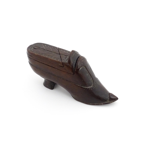 1199 - Treen : A 19thC novelty puzzle shoe snuff box of heeled shoe form with carved decoration. Approx. 4