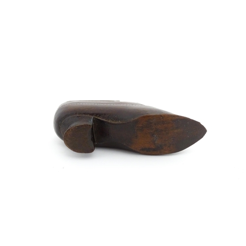 1199 - Treen : A 19thC novelty puzzle shoe snuff box of heeled shoe form with carved decoration. Approx. 4