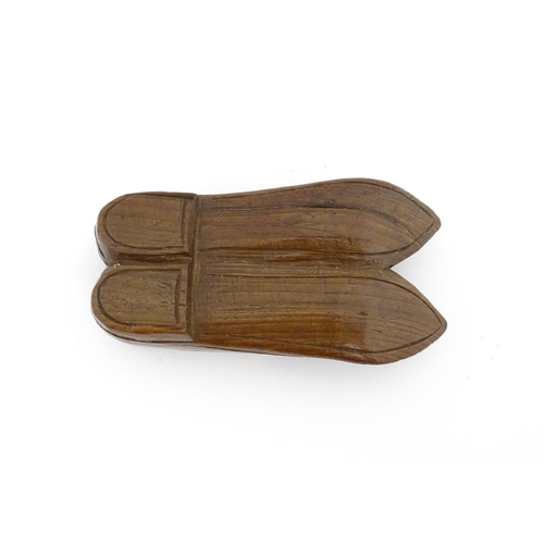 1200 - Treen : A 19thC shoe snuff box with chip carved decoration and carved figural detail to lid. Possibl... 