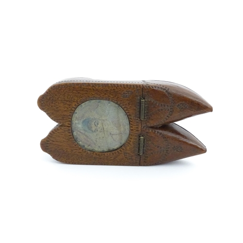 1202 - Treen : A 19thC Dutch shoe snuff box of double shoe form with chip carved decoration and inlaid circ... 