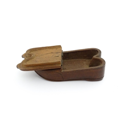 1202 - Treen : A 19thC Dutch shoe snuff box of double shoe form with chip carved decoration and inlaid circ... 