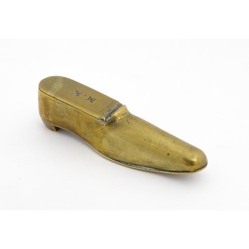 1209 - A 19thC brass shoe snuff box the hinged lid with the initials M. K. Approx. 3 3/4