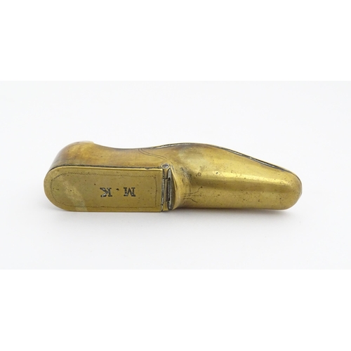 1209 - A 19thC brass shoe snuff box the hinged lid with the initials M. K. Approx. 3 3/4