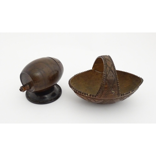 1210 - A 20thC carved coconut formed as a basket with geometric detail. Together with treen string box of b... 