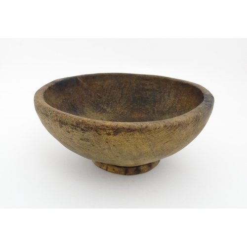 1211 - Treen : A 19thC Spanish carved wooden shepherd's bowl. Approx. 4 1/2