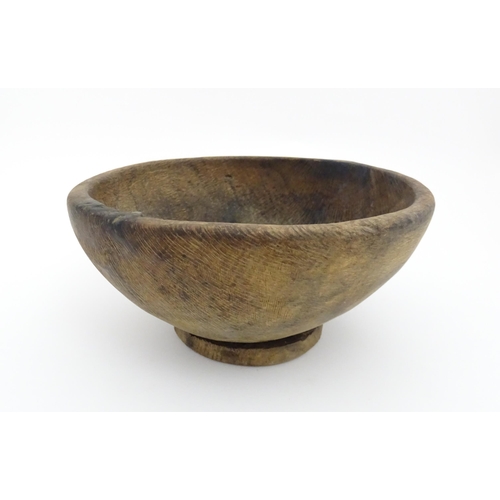 1211 - Treen : A 19thC Spanish carved wooden shepherd's bowl. Approx. 4 1/2