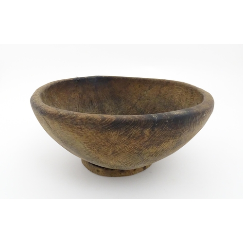 1211 - Treen : A 19thC Spanish carved wooden shepherd's bowl. Approx. 4 1/2