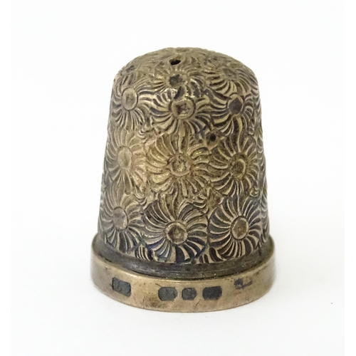 330 - Four assorted silver thimbles to include an example hallmarked Birmingham 1901 maker Henry Griffith ... 