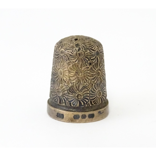 330 - Four assorted silver thimbles to include an example hallmarked Birmingham 1901 maker Henry Griffith ... 