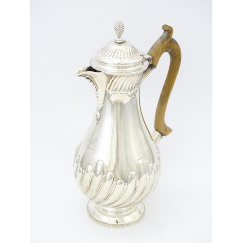 548 - A Victorian silver hot water pot with fluted detail and wooden handle, hallmarked 1880, maker Thomas... 