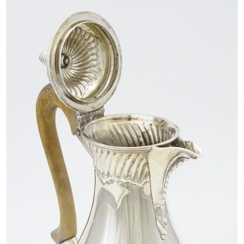 548 - A Victorian silver hot water pot with fluted detail and wooden handle, hallmarked 1880, maker Thomas... 