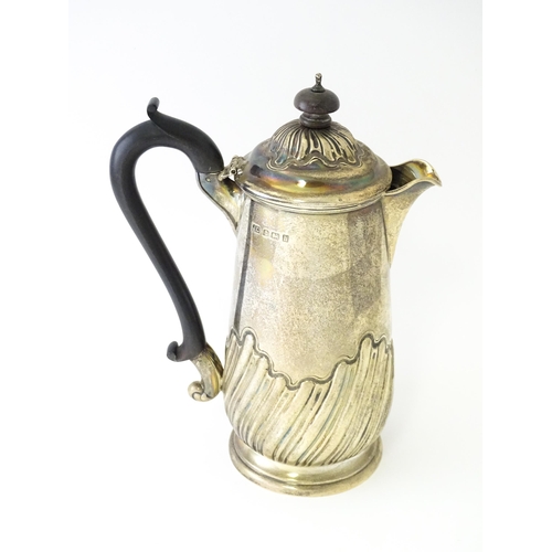 549 - A silver coffee pot with fluted decoration and ebonised handle hallmarked Birmingham 1907, maker Jos... 