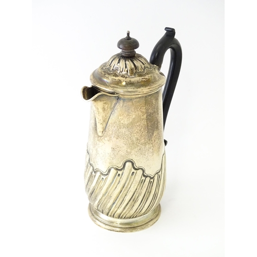 549 - A silver coffee pot with fluted decoration and ebonised handle hallmarked Birmingham 1907, maker Jos... 